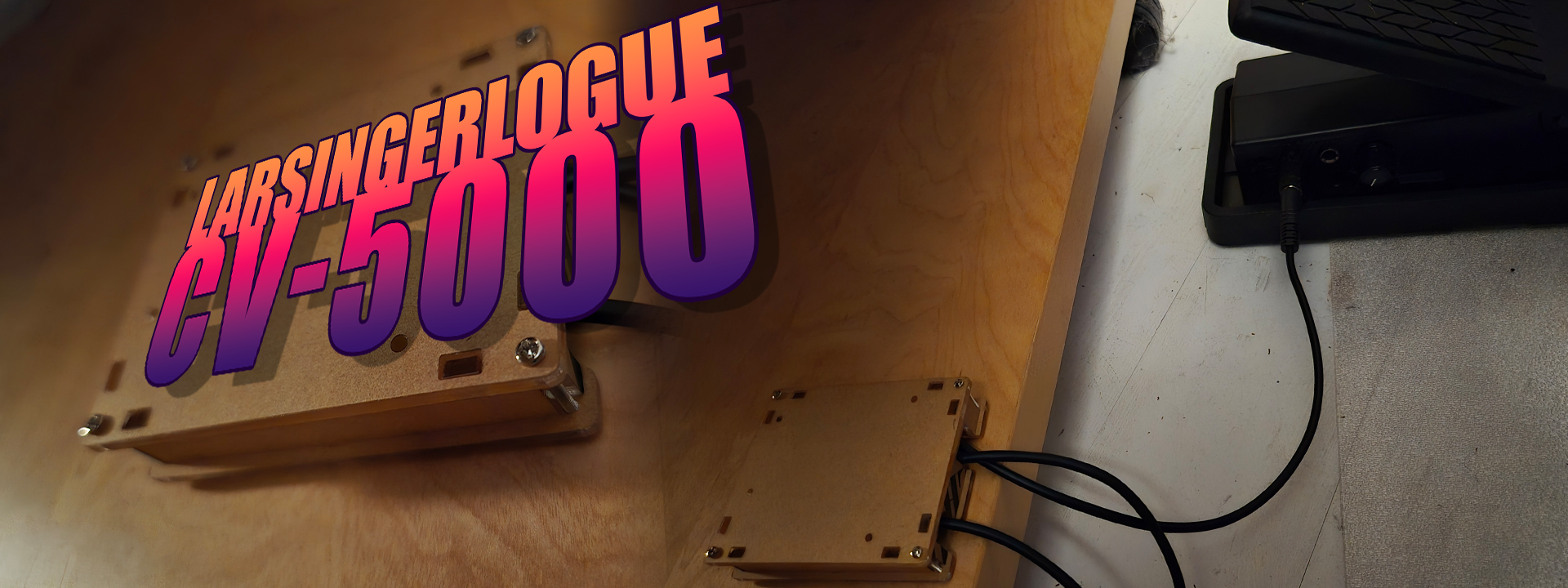 A logo with the text Larsingerlogue CV-5000 and an FCV100 connected to a gray box
